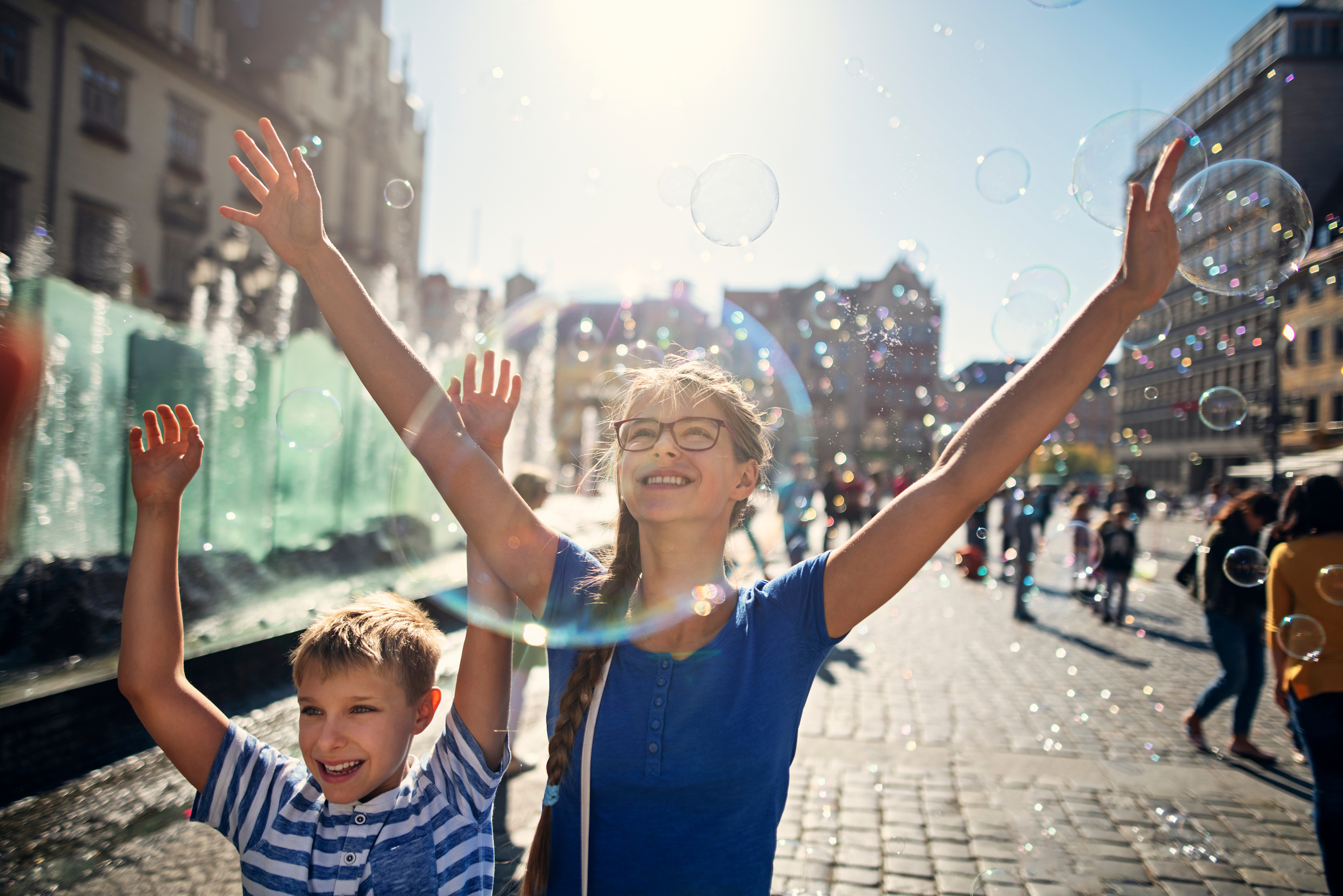 Kids enjoying bubbles in Market Square in Wrocław, Poland